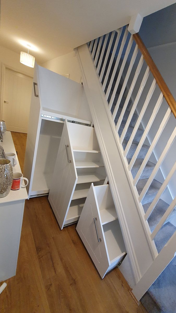 Family-run carpenters installing fitted storage in Kent