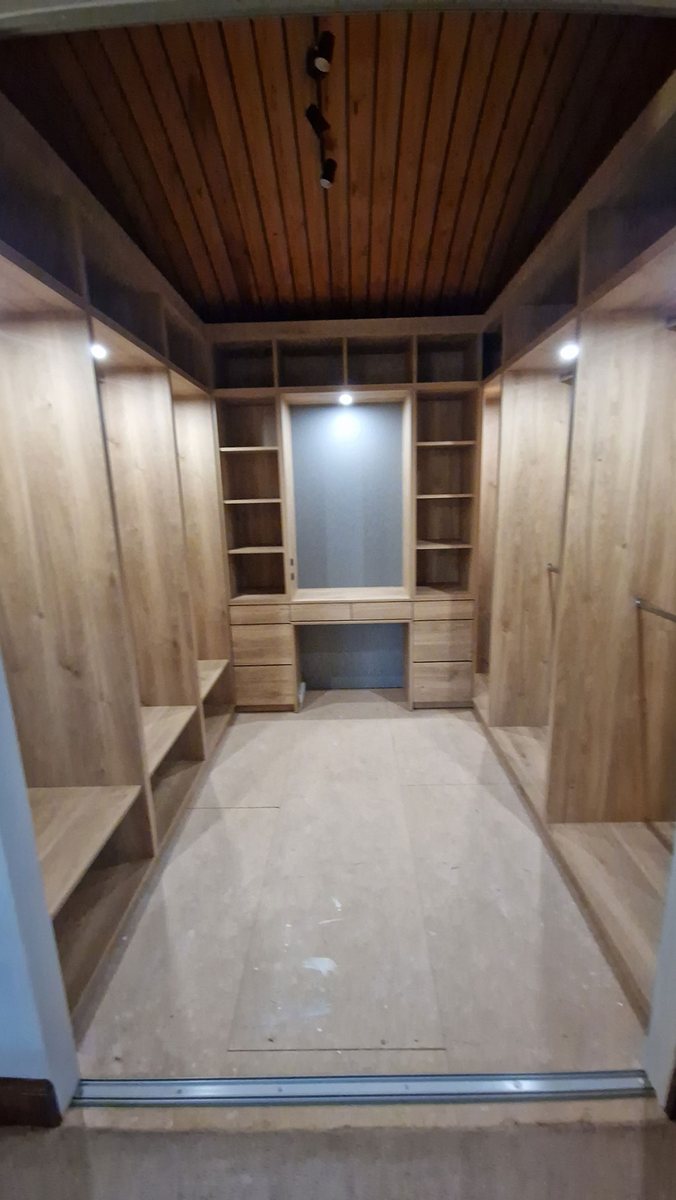 Bespoke fitted wardrobe interior with shelving and hanging rails